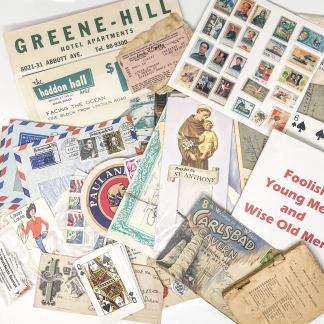 Curated paper ephemera lot including postcards, tickets, and old advertisements
