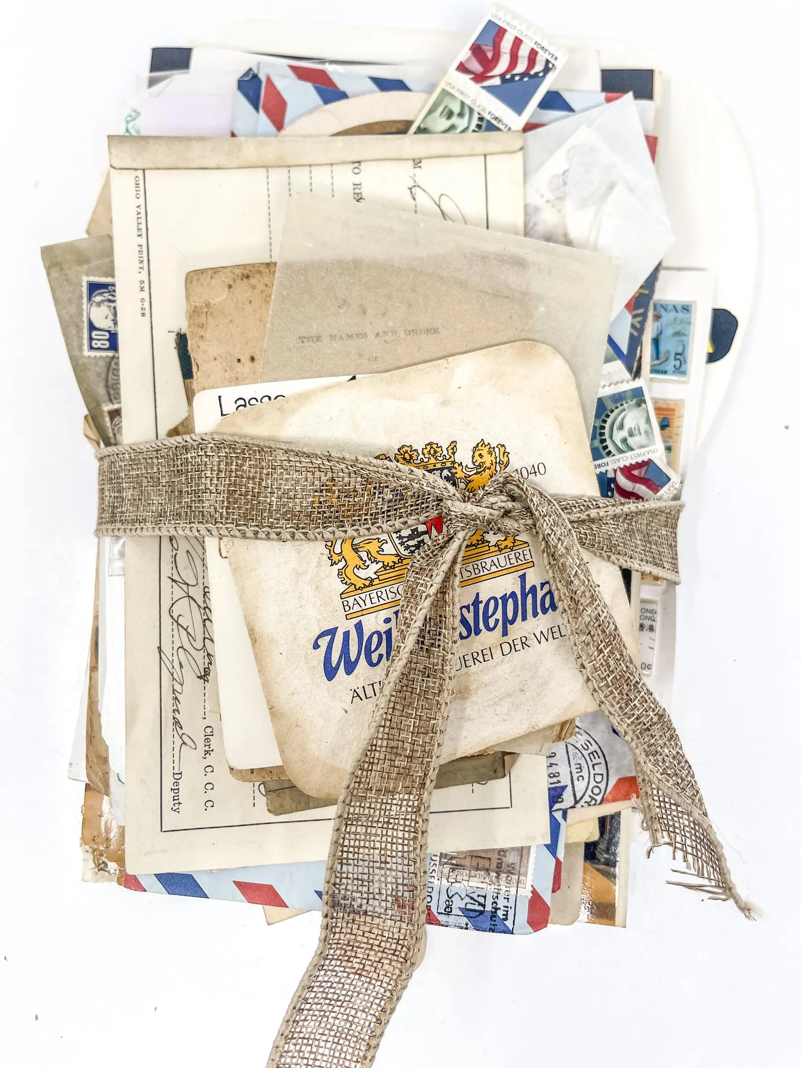 Curated paper ephemera lot including postcards, tickets, and old advertisements