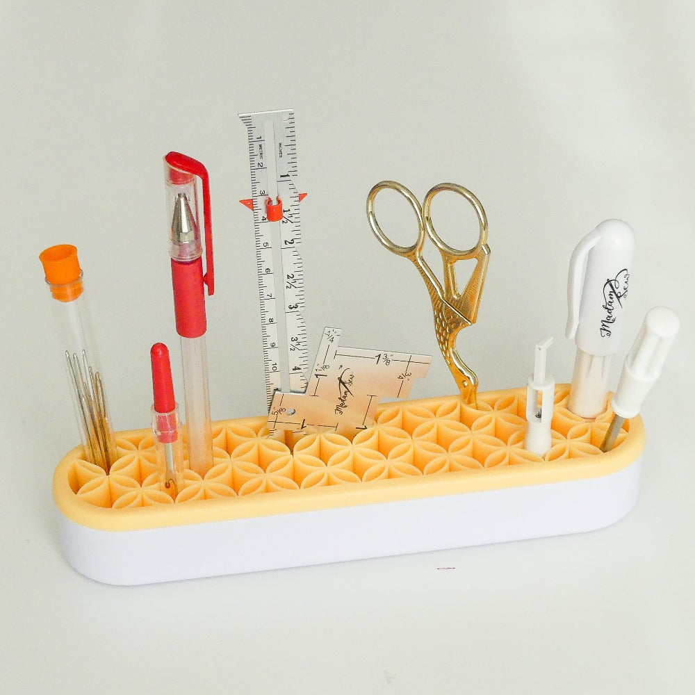 Desk top tool caddy with tools in it
